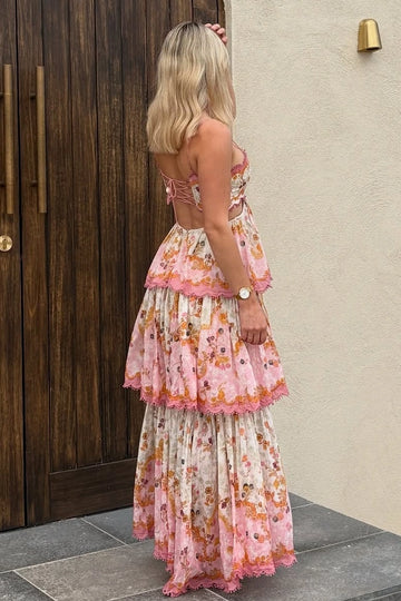 Pink floral wedding guest dress with lace-up open back and tiered maxi skirt by Vedress