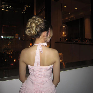 Pink floor length prom dress with halter neck tie and lace-up corset back by Vedress