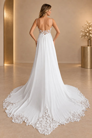 Back view of Vedress wedding dress with a low scoop back, petite lace-up detail and sweeping train edged in floral lace.