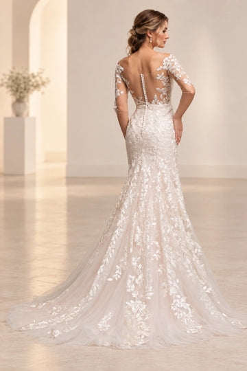 Back view of Vedress mermaid wedding dress with sheer illusion panels, botanical lace, covered buttons and a flared lace train.