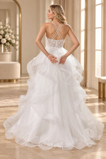 Back view of Vedress wedding dress with double crisscross straps, an open back, lace waist panel and cascading ruffles.