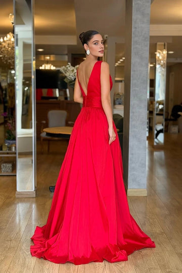 Red floor-length prom dress with low V-back and full flowing skirt