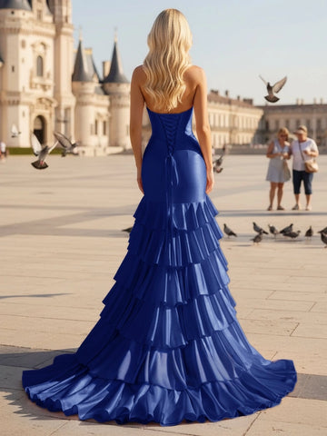 Royal blue mermaid prom dress with lace-up corset back and tiered ruffle floor length skirt back view