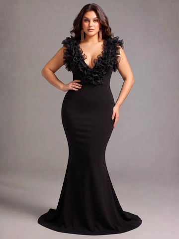 Vedress black mermaid evening dress with a deep V-neckline, sheer ruffle trim, and floor-length skirt with a sweep train.