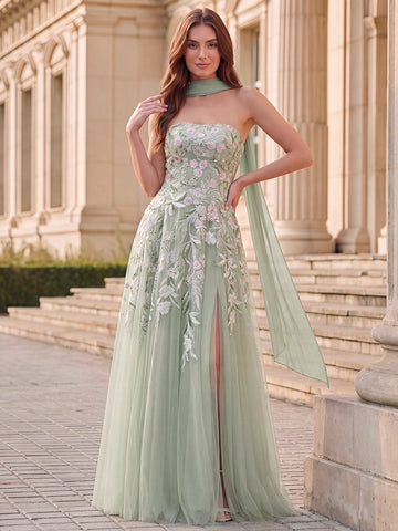Sage green A-line strapless prom dress with pink floral embroidery, embellished fitted bodice, flowing tulle skirt, front slit and matching sheer scarf.