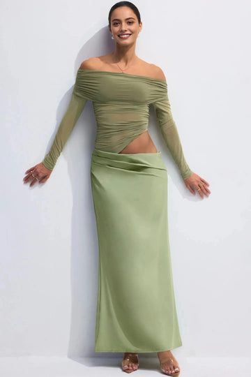 Sage green wedding guest dress with off-shoulder neckline, ruched long sleeves and asymmetric waist cutout by Vedress