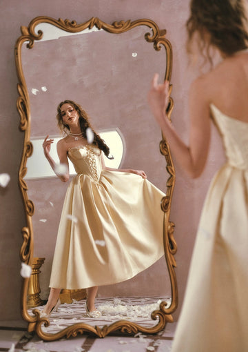 Front, side and back views of Vedress satin prom dress with lace trim, corset lacing, a pointed waist and full ankle-length skirt.
