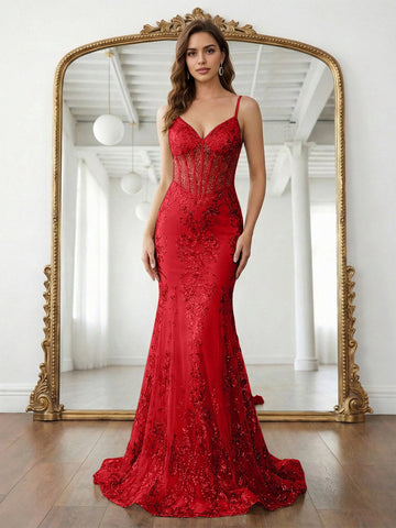 Vedress red mermaid prom dress with a V-neck, spaghetti straps, sheer corset bodice, scrolling sequin patterns, and sweep train, front view.
