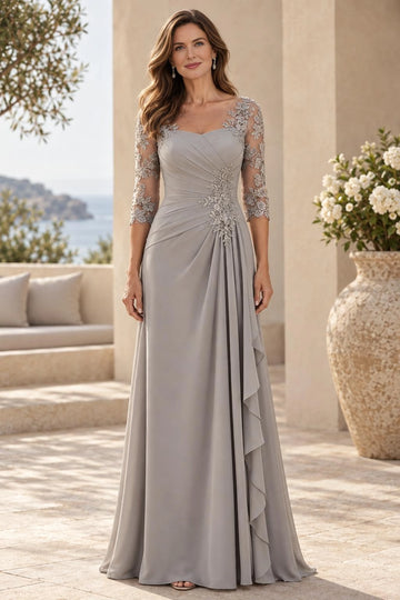 Silver gray A-line mother of the bride dress with sheer illusion neckline, floral lace three-quarter sleeves, ruched waist and cascading front ruffles