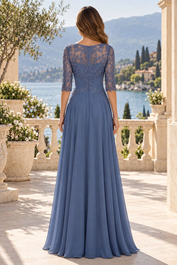 Back view of slate blue mother of the bride dress featuring floral lace illusion back, center zipper, ruched waist and flowing A-line skirt