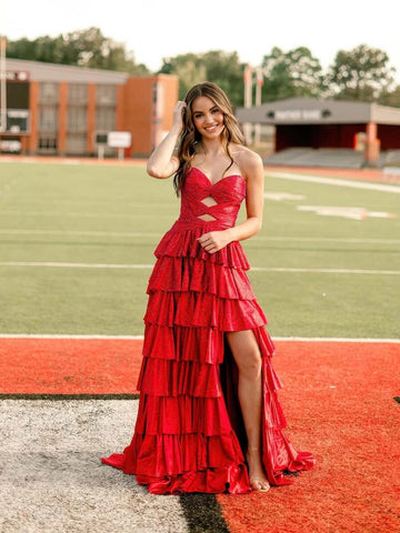 Vedress red sparkly A-line prom dress with a strapless sweetheart neckline, two front cutouts, tiered ruffles, and high slit, front view.