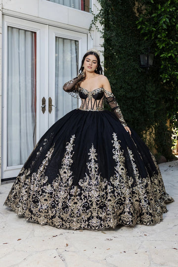 Vedress black and gold quinceañera ball gown with a sweetheart corset bodice, draped beaded shoulder accents and ornate gold appliqués.