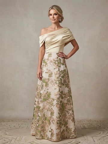 Vedress champagne A-line mother of the bride dress with an asymmetric neckline, draped short sleeves and a green floral skirt, front view.
