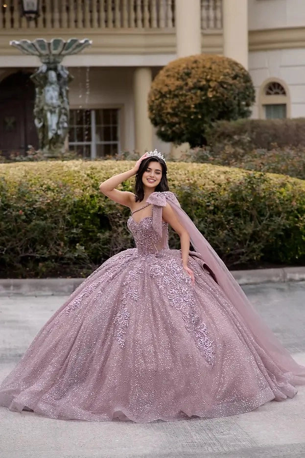 Vedress mauve ball gown quinceañera dress sweetheart one shoulder neckline glitter lace applique cape bow voluminous skirt front view
