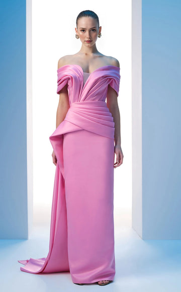 Front view of a pink off-shoulder wedding guest dress with a V neckline, wrapped waist and long side drape