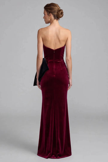 Back view of Vedress burgundy velvet mermaid evening dress with a low curved neckline, center-back zipper and floor-length skirt.