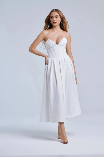 White wedding guest dress with strapless sweetheart neckline, structured corset bodice and A-line skirt by Vedress