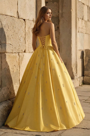Yellow floor length prom dress with lace-up corset back and full ball gown skirt by Vedress